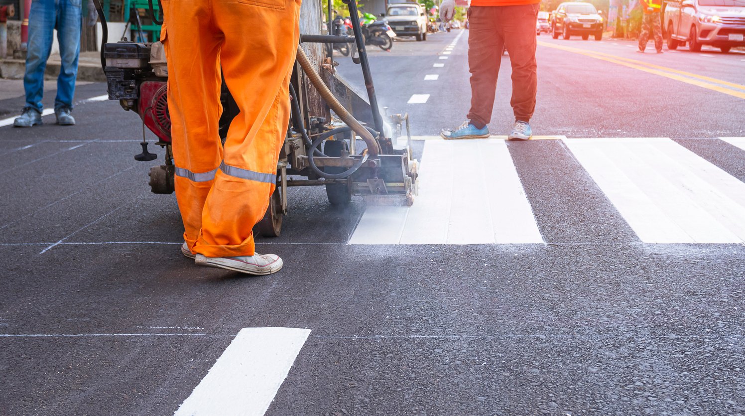 Low Section of Road Workers Group with Thermoplastic Spray Marki